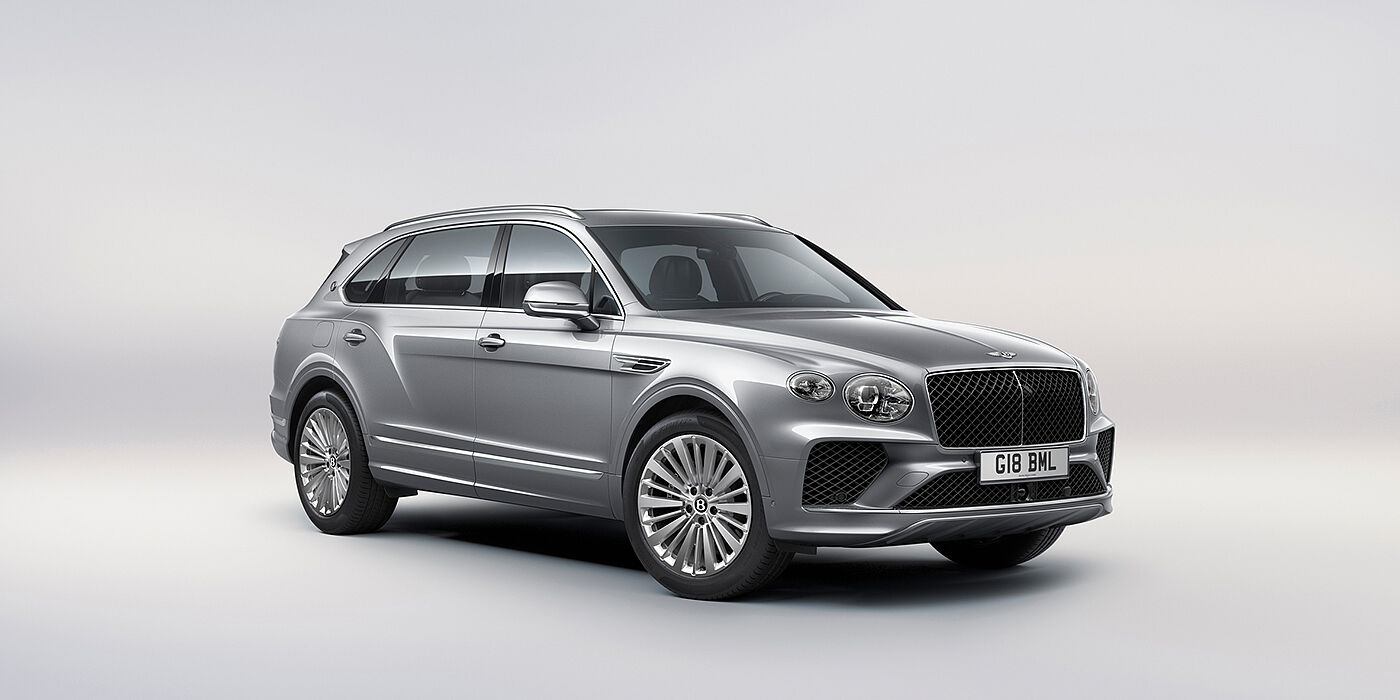 Bentley Panama Bentley Bentayga Extended Wheelbase luxury SUV front three quarter view in Moonbeam paint with 21 inch five spoke painted wheels
