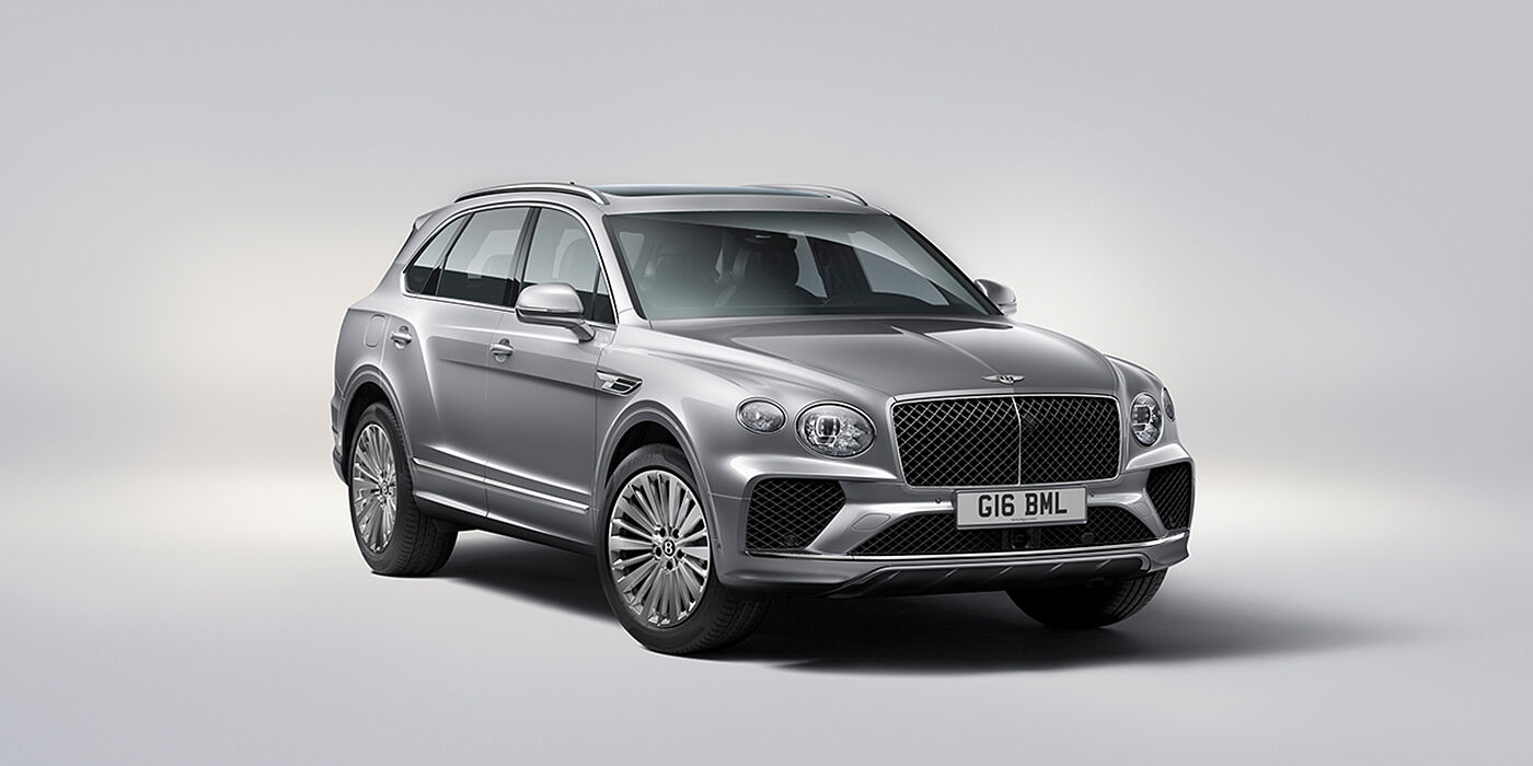 Bentley Panama Bentley Bentayga luxury SUV front three quarter view in Moonbeam paint with matrix grille and 21″ 5 spoke painted wheels