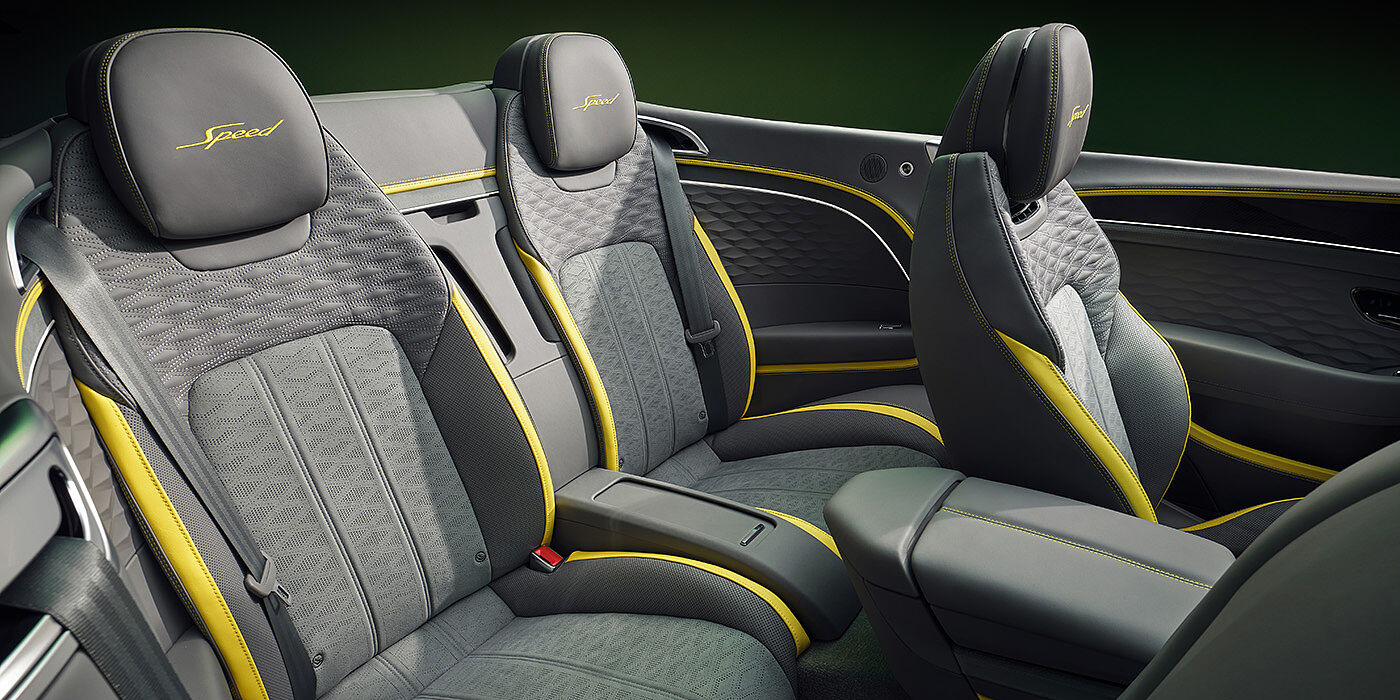 Bentley Panama Bentley New Continental GTC Speed convertible rear interior with unique Speed colour split in Gravity Grey and Cyber Yellow hide colours, and contrast stitched headrest emblems 