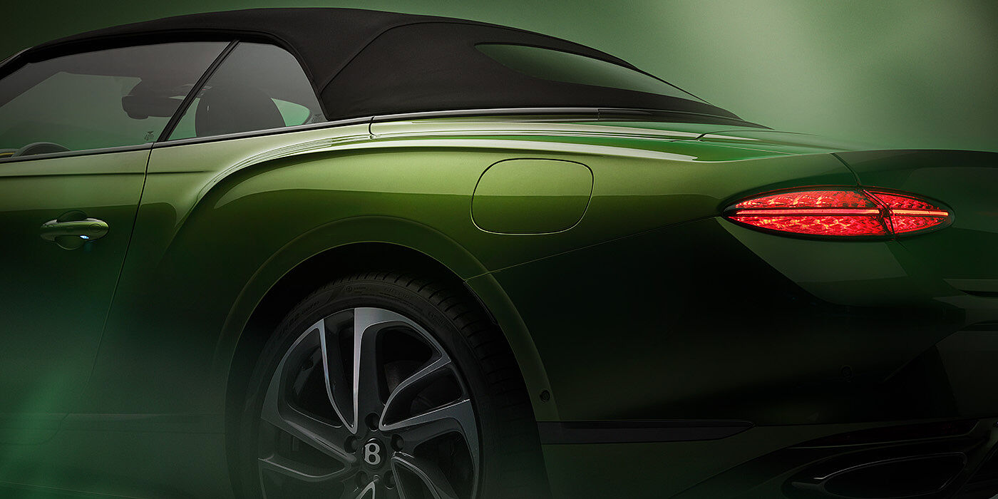 Bentley Panama Bentley New Continental GTC Speed rear haunch and tail lamp in Tourmaline Green paint and dark tint brightware with black hood up and illuminated head lamps