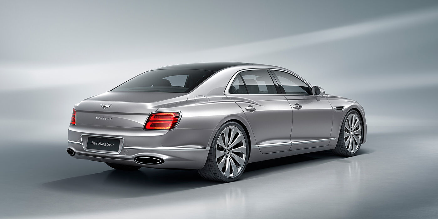 Bentley Panama New Bentley Flying Spur sedan rear view in Silverlake paint with ten spoke wheels and chrome matrix grille